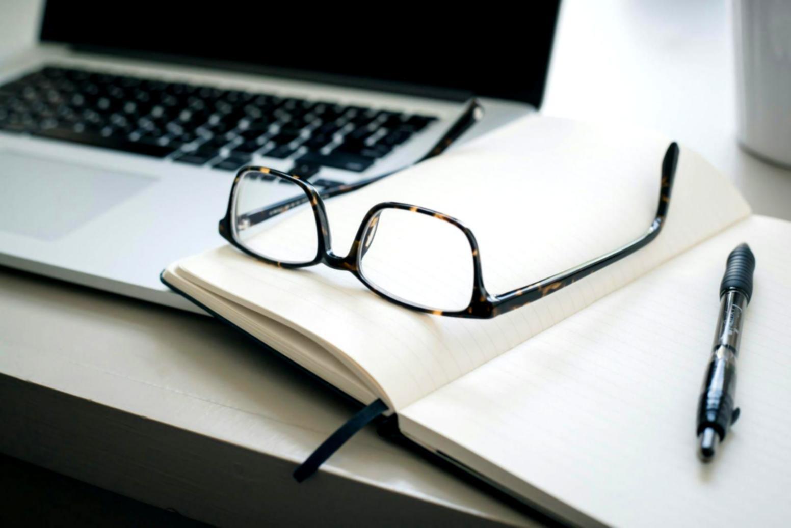 Students working with financial analysis tools and investment research materials